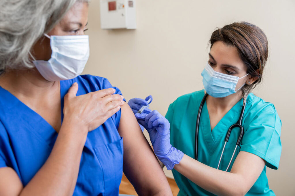 woman getting covid vaccine