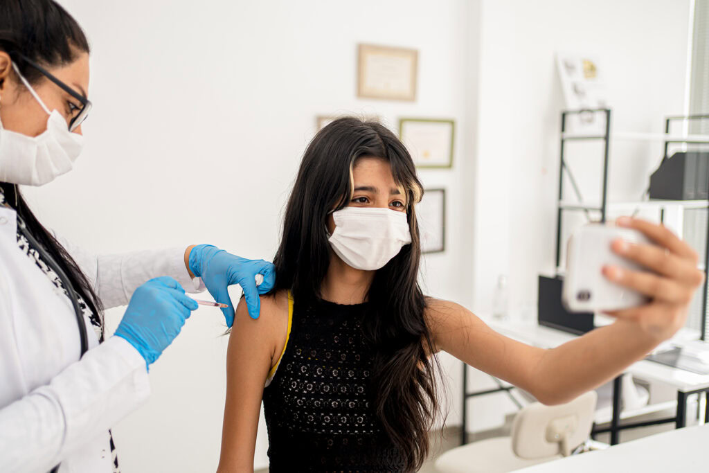 Doctor vaccinating girl