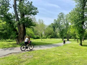 two cyclist riding on a path in Riverfront Park