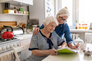 Caregiver and patient read a paper