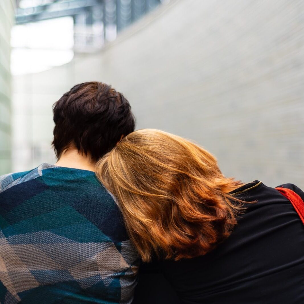 two people comforting each other